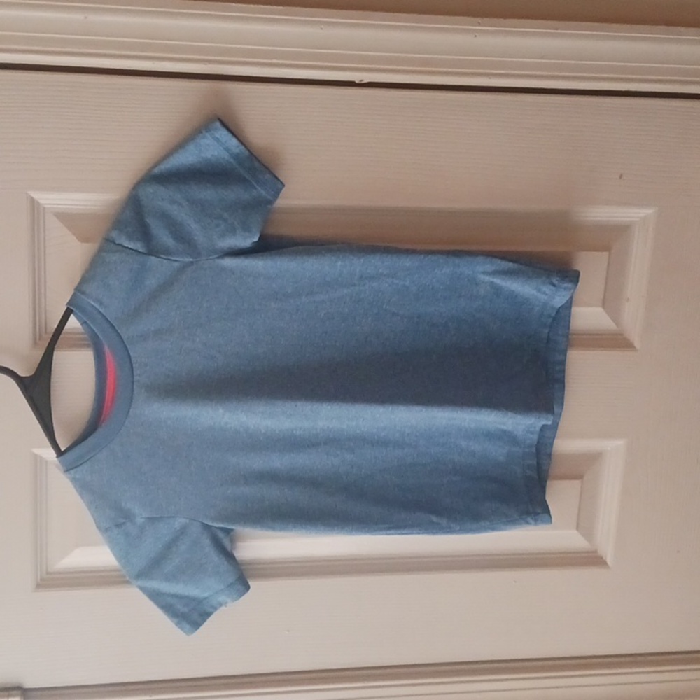 Mad Game size 6/7. Blue short sleeve shirt.